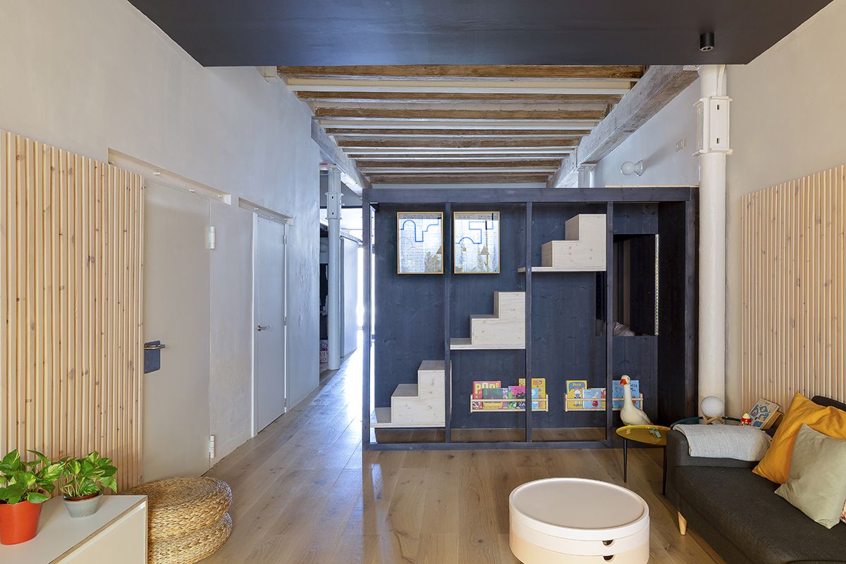 The staircase which leads up to the roof is disguised as a set of bookshelves