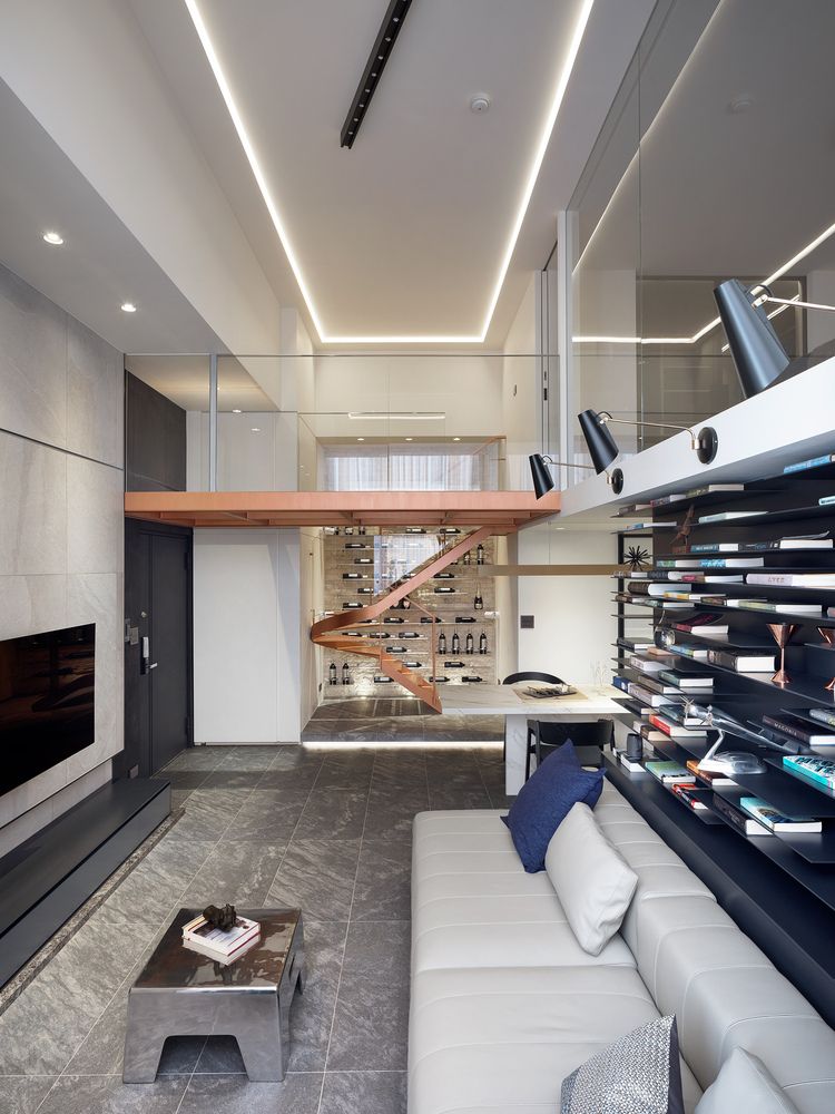 Thanks to its sleek design and glass railings, the staircase doesn't take up a lot of space yet stands out