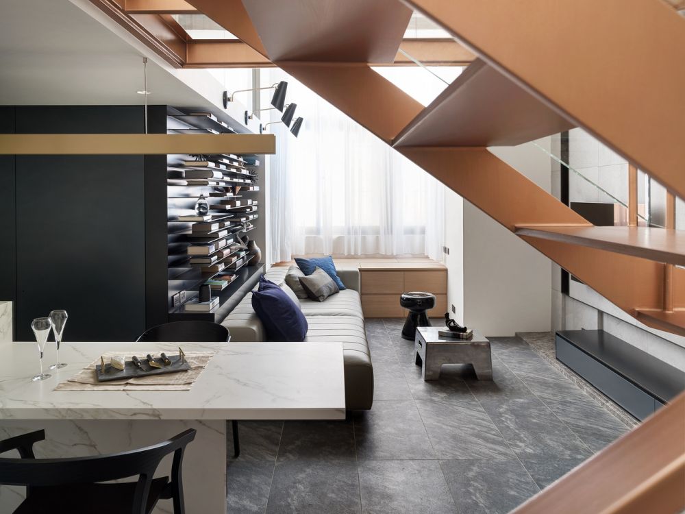 The bookshelves and the wine rack put an emphasis on the horizontal plane