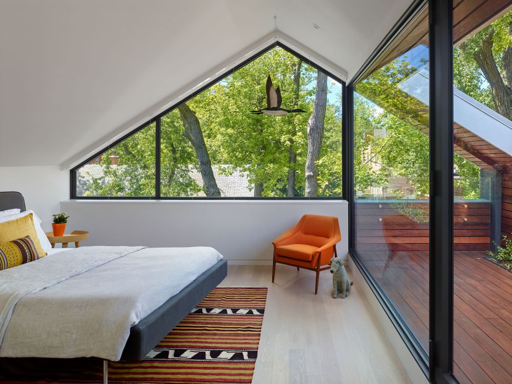 The master bedroom occupies the top floor and has its own open roof deck which bring it closer to nature
