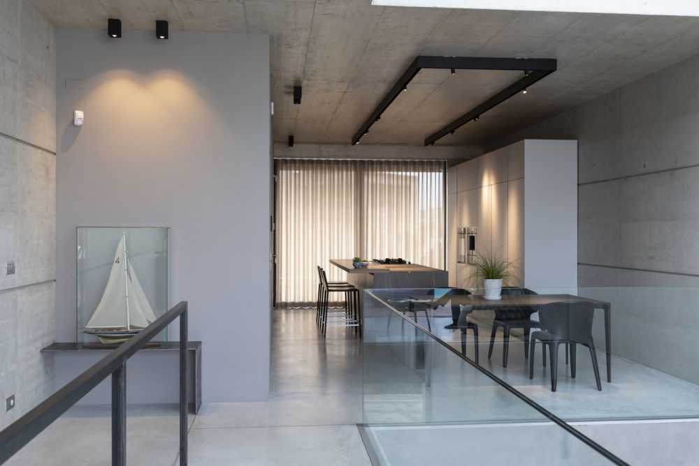 The interior design and decor are very simplistic and create almost an austere vibe throughout the house