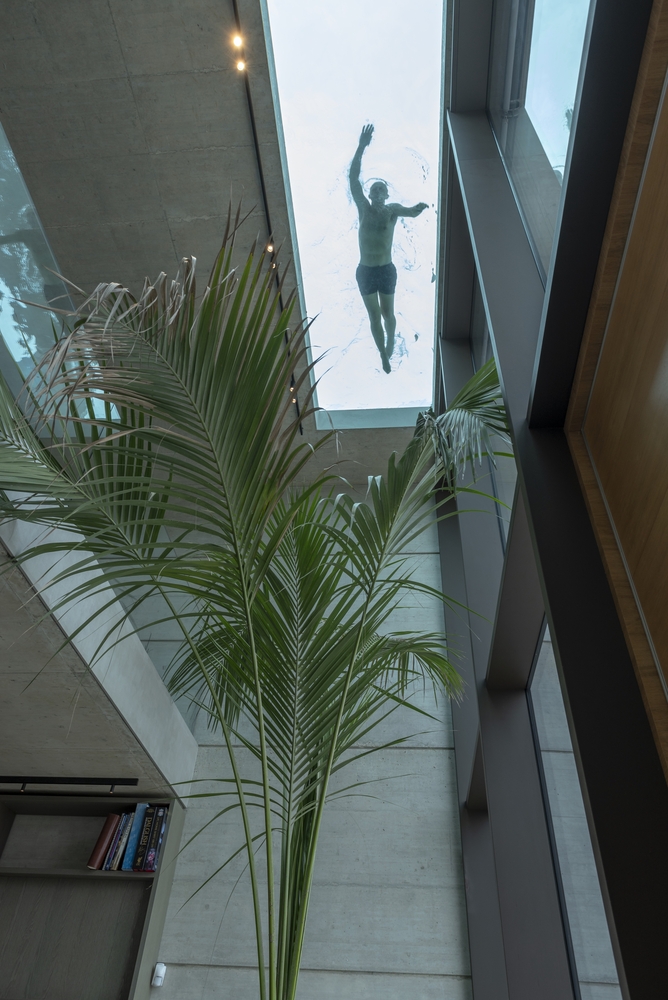 The entrance is a double-height space which lets you see directly into the pool situated just above it