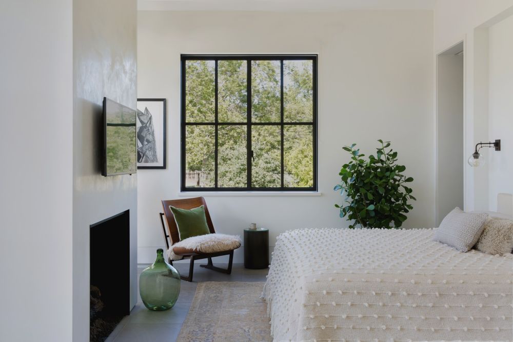 The black window frames contrast with the white walls and add a very nice touch to the decor