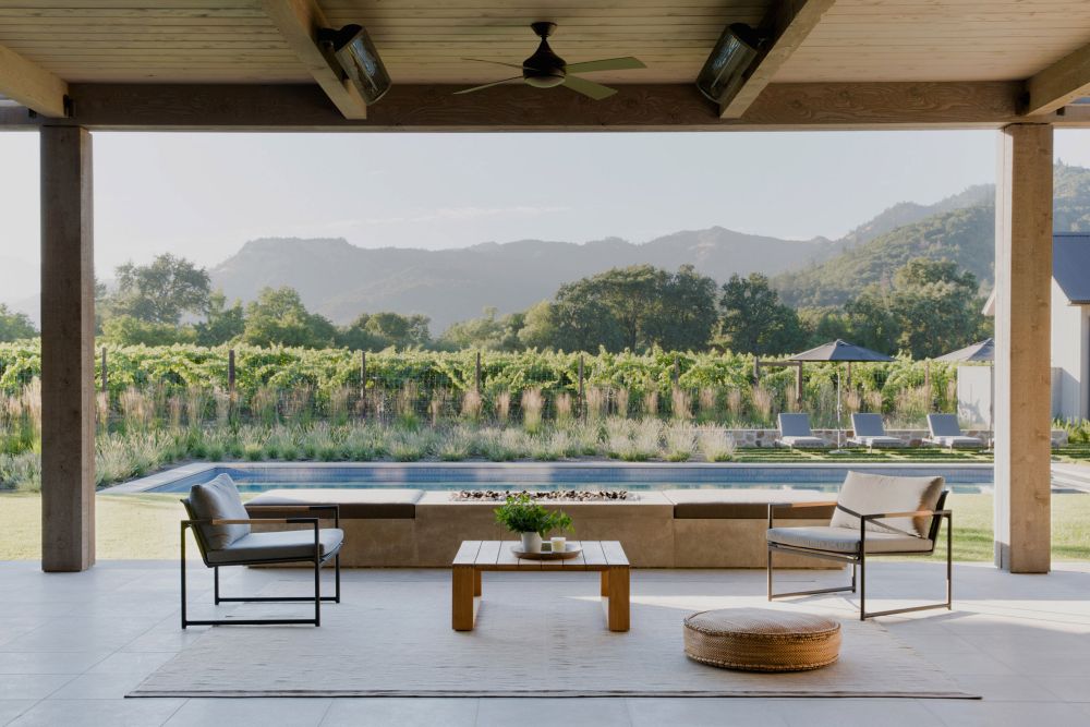 A large covered patio allows the living areas to extend outdoors and offers views of the vineyards and mountains