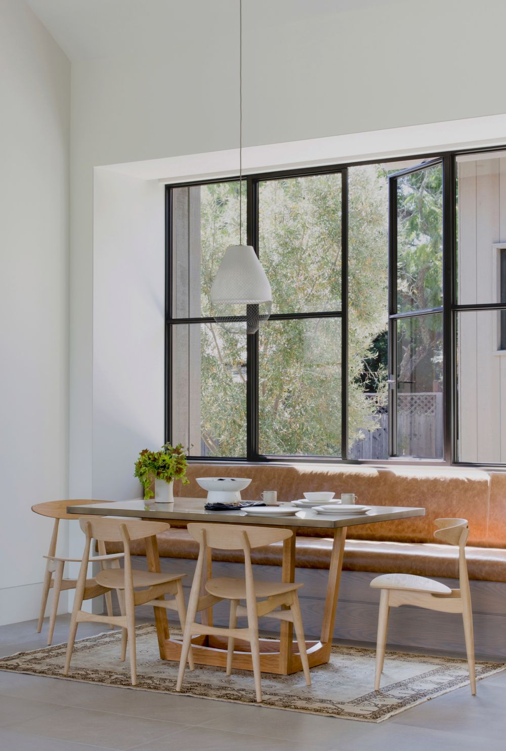 There's also a casual dining area, a nook with bench seating on one side and chairs on the other
