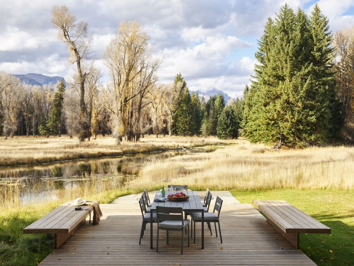 This modern wooden deck is one of the best spots on the property, perfect for admiring the scenery