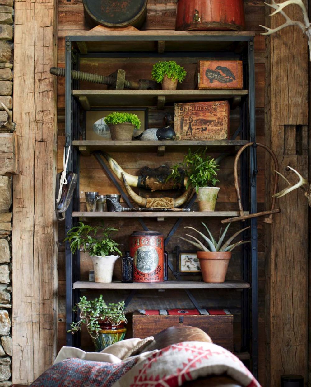 Vintage furniture and antiques are spread throughout the house, creating an authentic rustic interior design