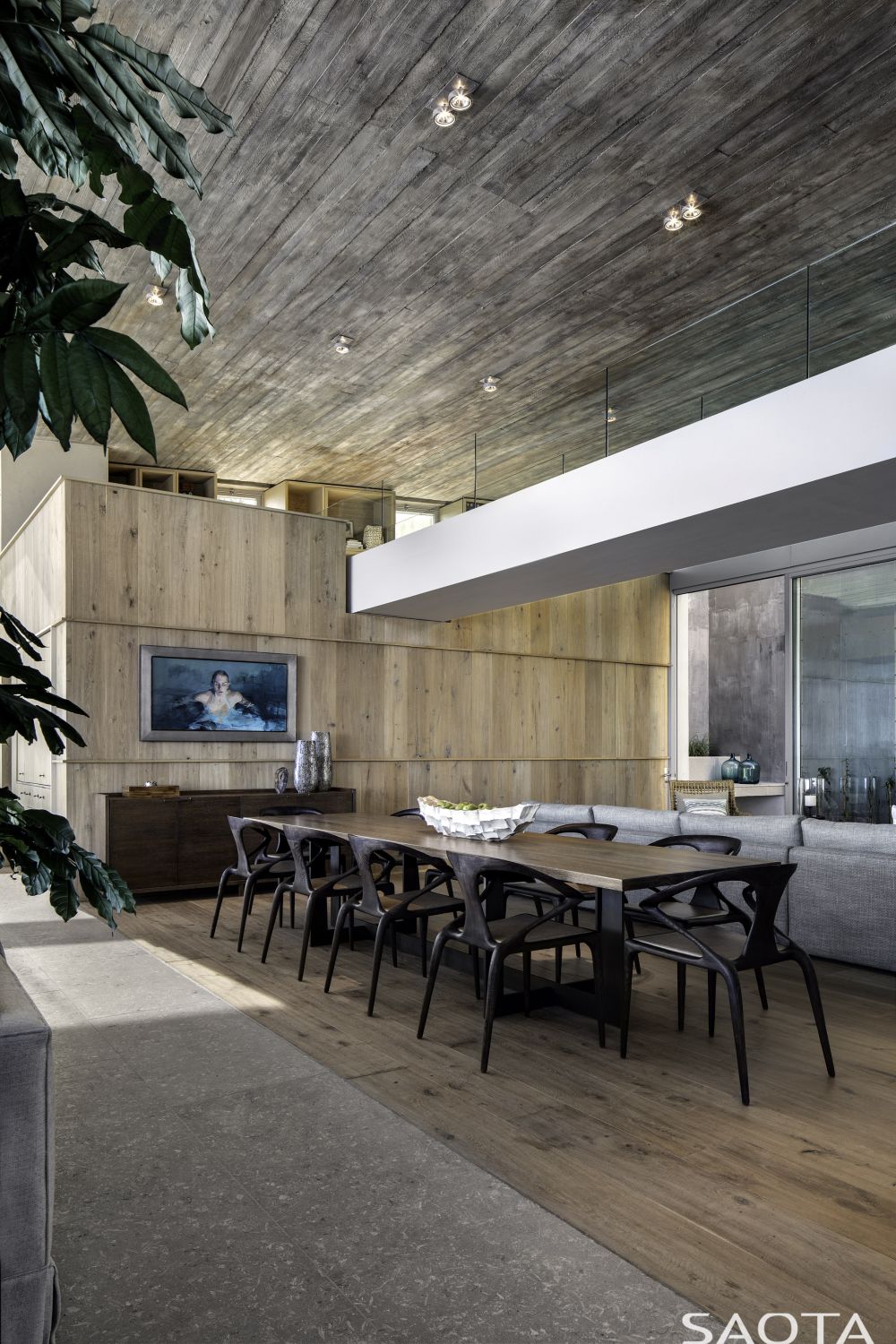 The interior decor is personalized with a variety of art pieces including paintings and sculptures