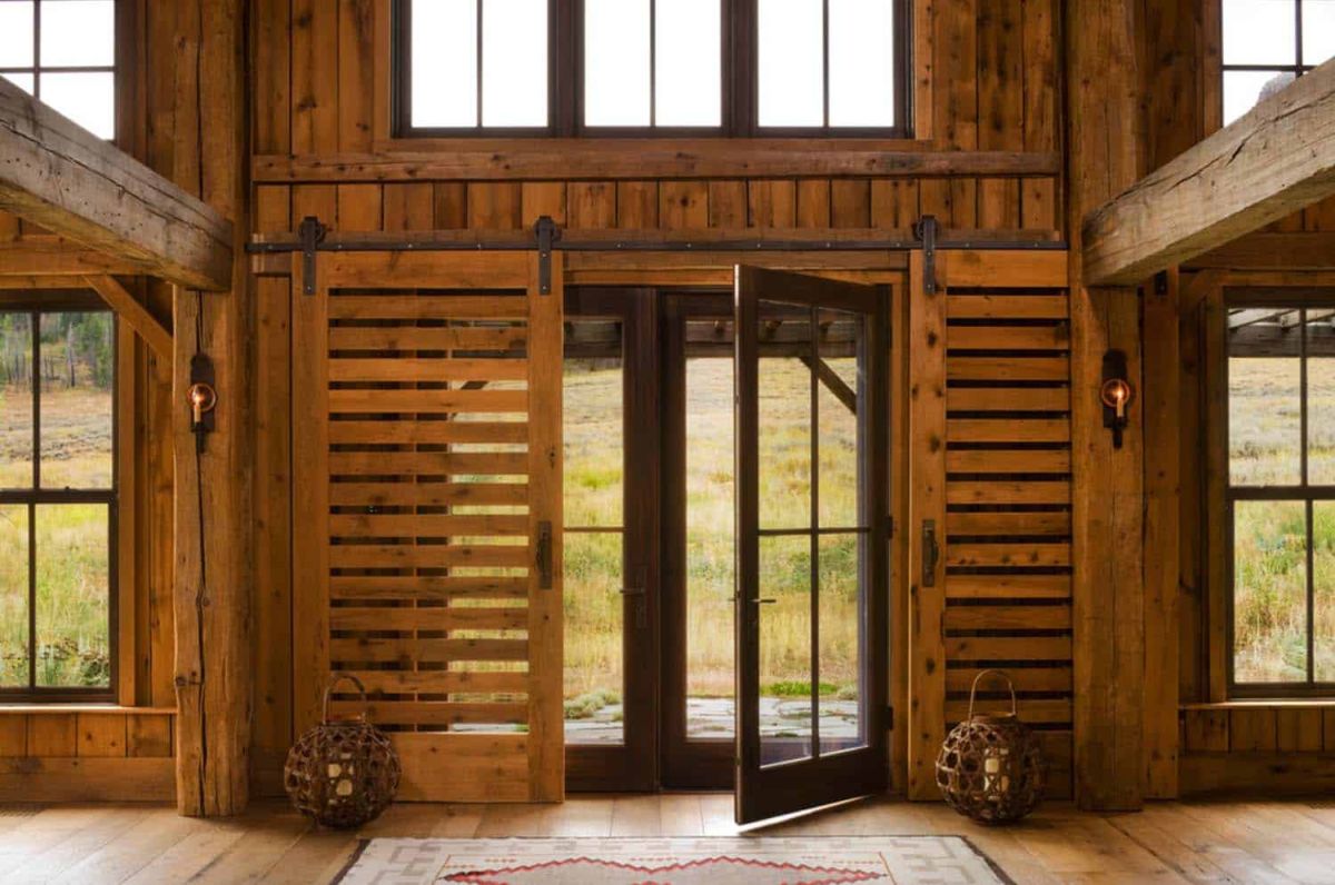 The house actually has a surprising amount of large windows and openings which connect it to its immediate surroundings