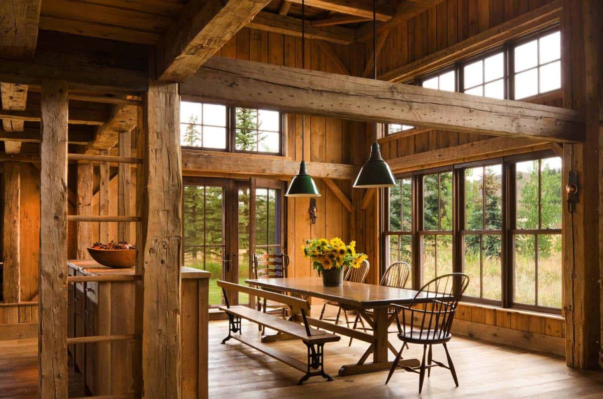 The dining room is framed by large windows on two sides and gets to enjoy abundant natural lights and views of the serene surroundings