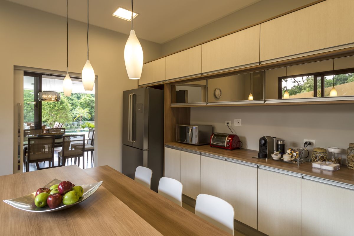 The kitchen and dining room are blended into one space with a very warm and inviting appearance