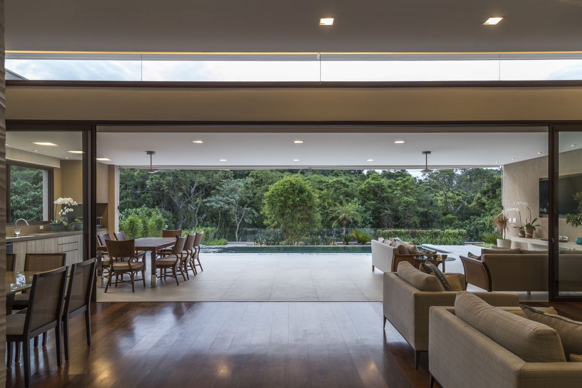 The leisure areas are connected on an open floor plan with full-height sliding doors which frame the view