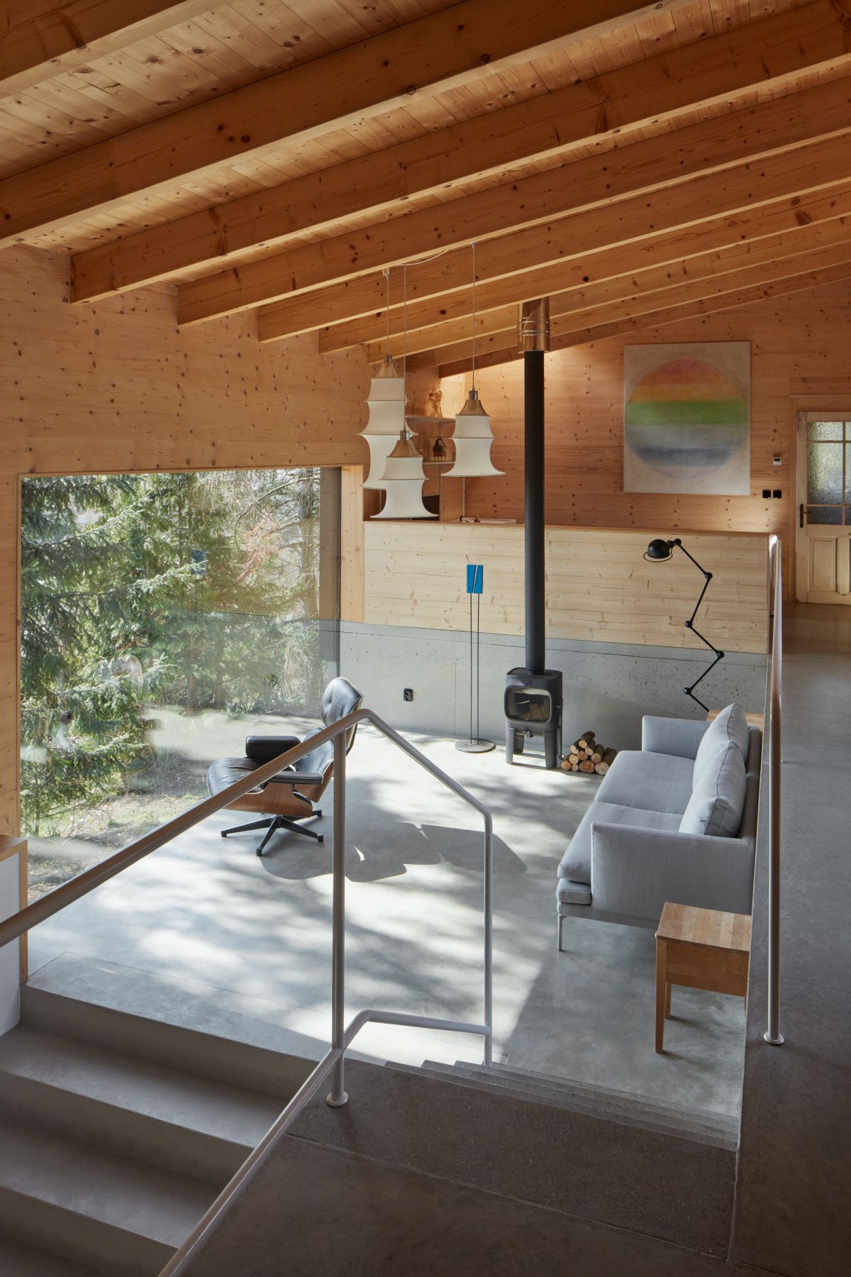 This cozy living room is small and simple-looking, with a large panorama window as a focal point
