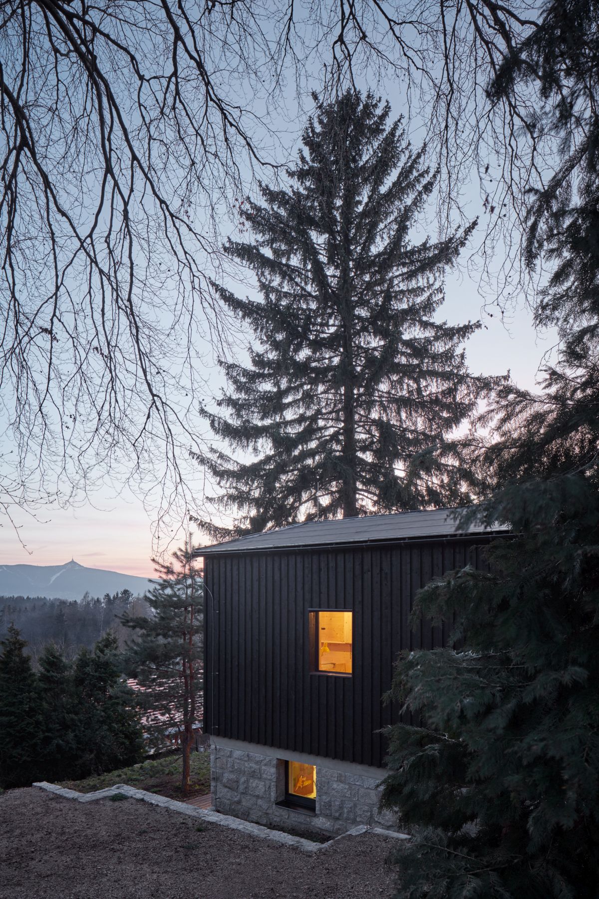 The house overlooks a beautiful valley and was designed to take advantage of the view