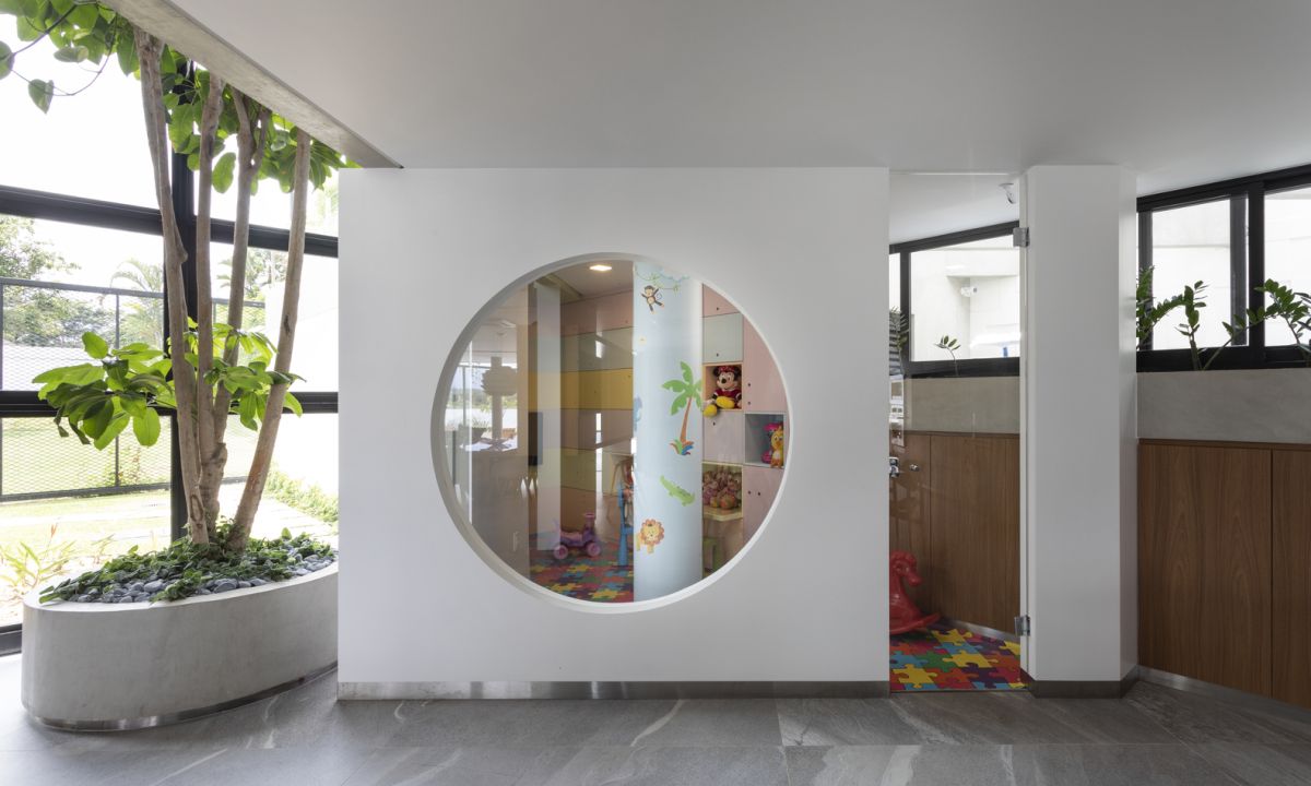 The playroom area resembles a box with a large circular window and looks very playful
