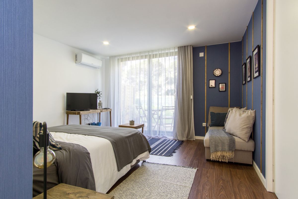 The bedrooms are decorated with cool and relaxing shades of blue complemented by neutrals