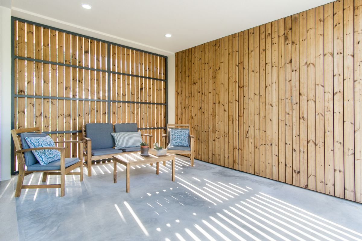 The contrast between crisp white ceiling, polished floor and the warm wood on the walls is a very pleasant one