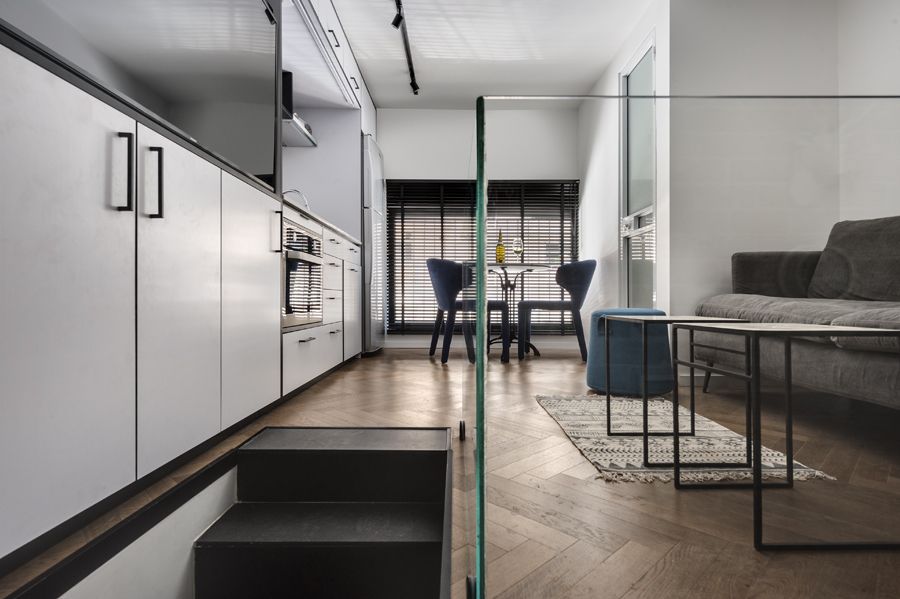 Both floors have wooden parquet flooring which adds warmth and color to the spaces