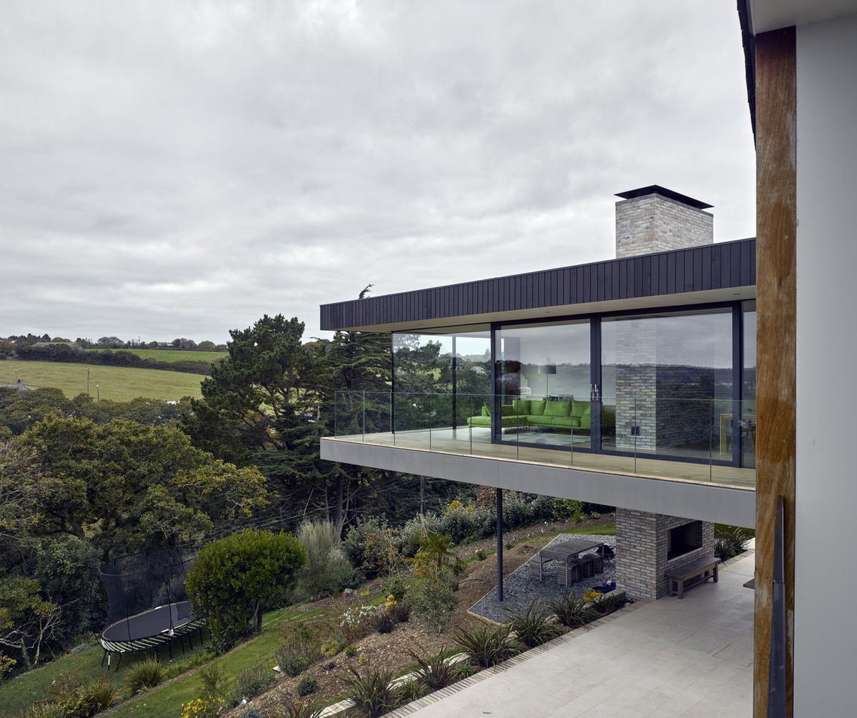 The chimney runs through the living room extending above and below the volume