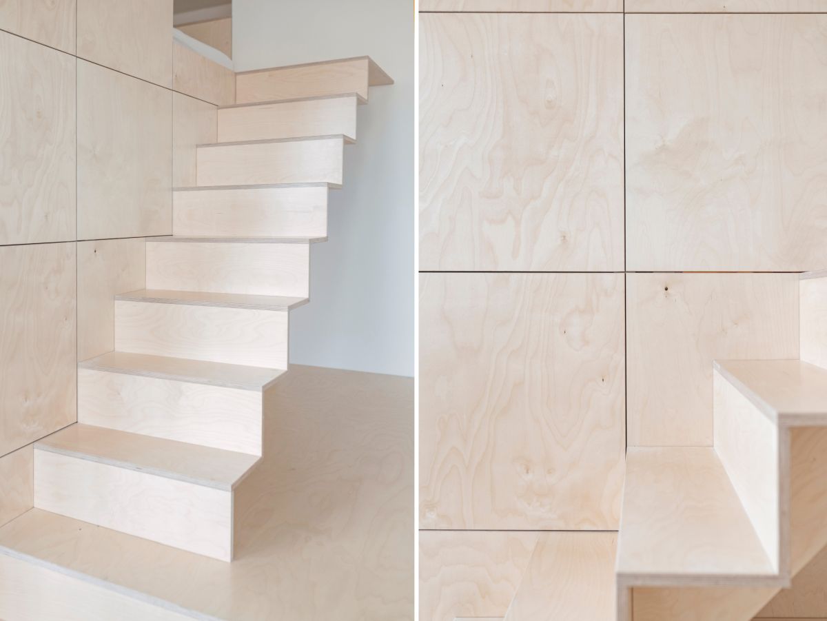 The sleeping area can be accessed via a sleek and sculptural staircase with an origami-like design