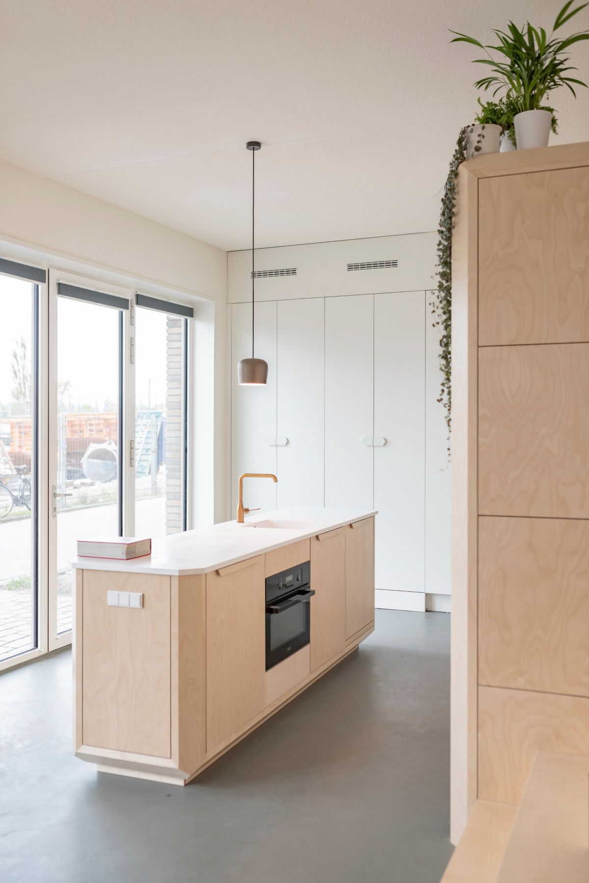 The large windows bring in lots of natural light and expose the common areas to the view