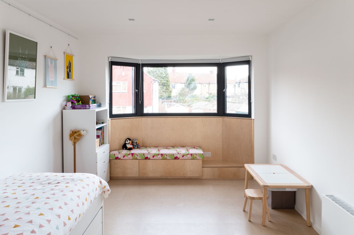 The kids' bedroom has two sections that mirror each other, a perfect design for the twins