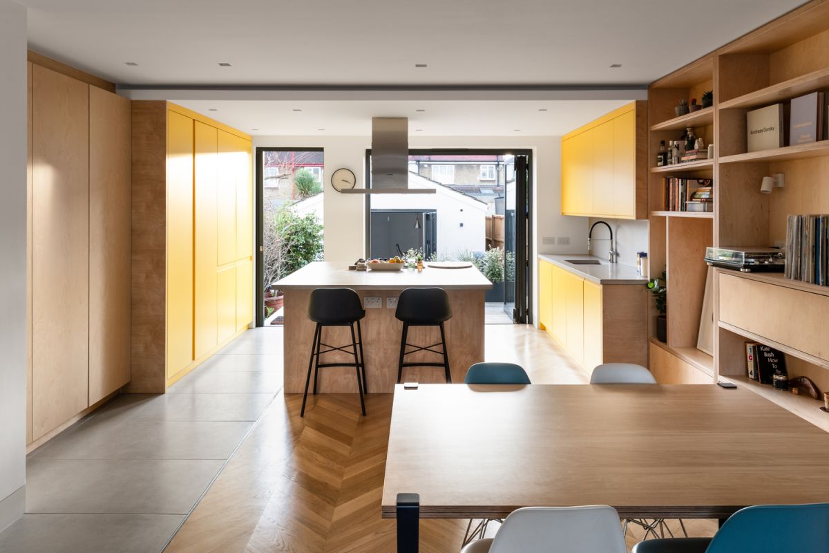 From the living room area there's a clear view towards the outbuilding, with a courtyard in between