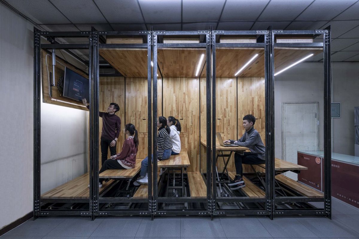 Several modular units can be lifted and lowered individually and can serve as both desks and benches