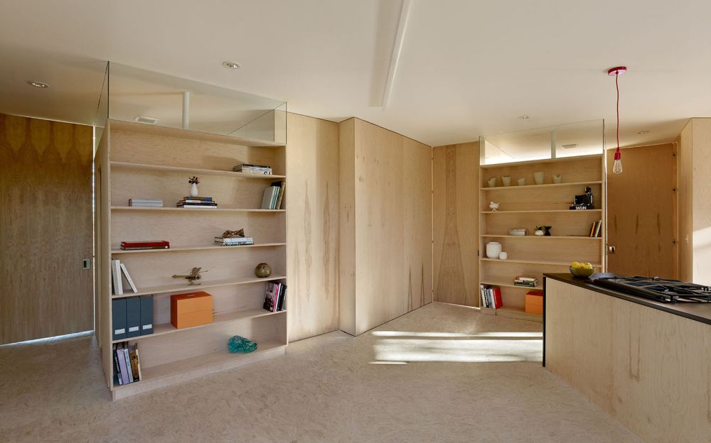 Unfinished plywood and OSB sheets were used for the interior of the house, keeping the design simple and the cost low