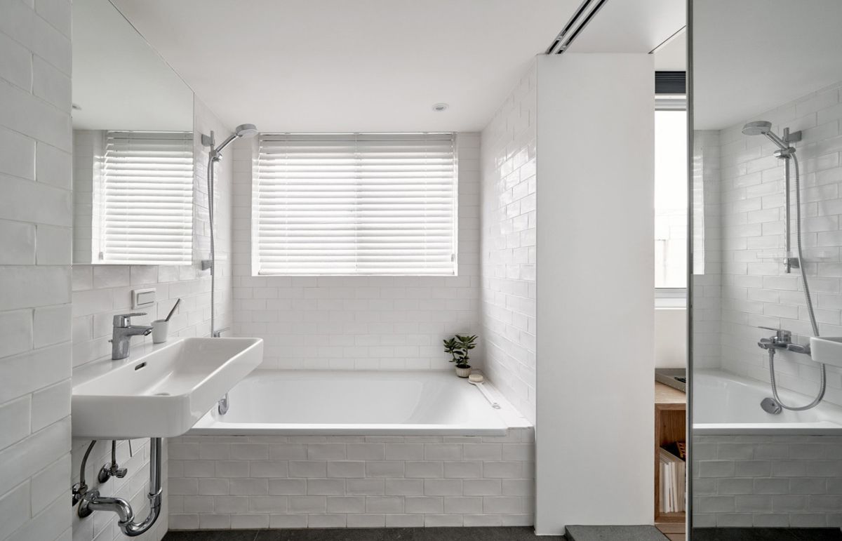 The bathroom now has more sunlight than before and a mirror door which helps it appear larger