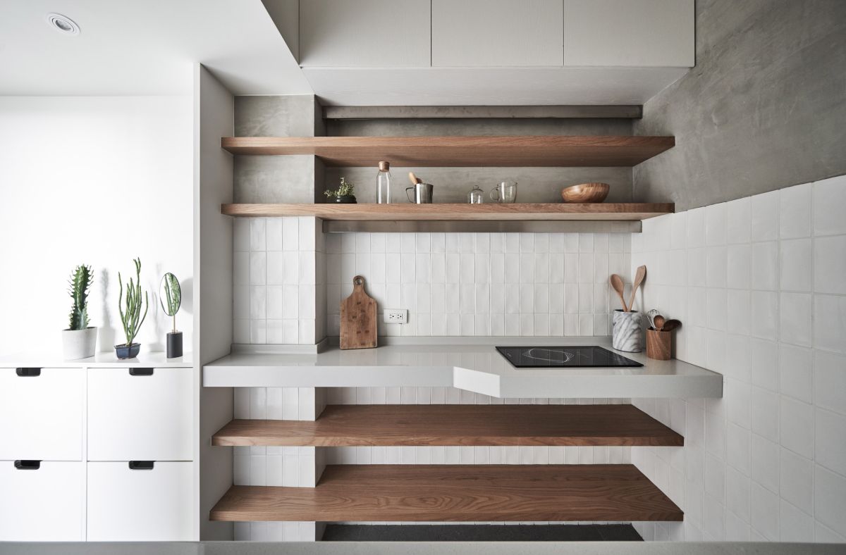 The kitchen seamlessly transitions into the entryway but at the same time maintains its independence