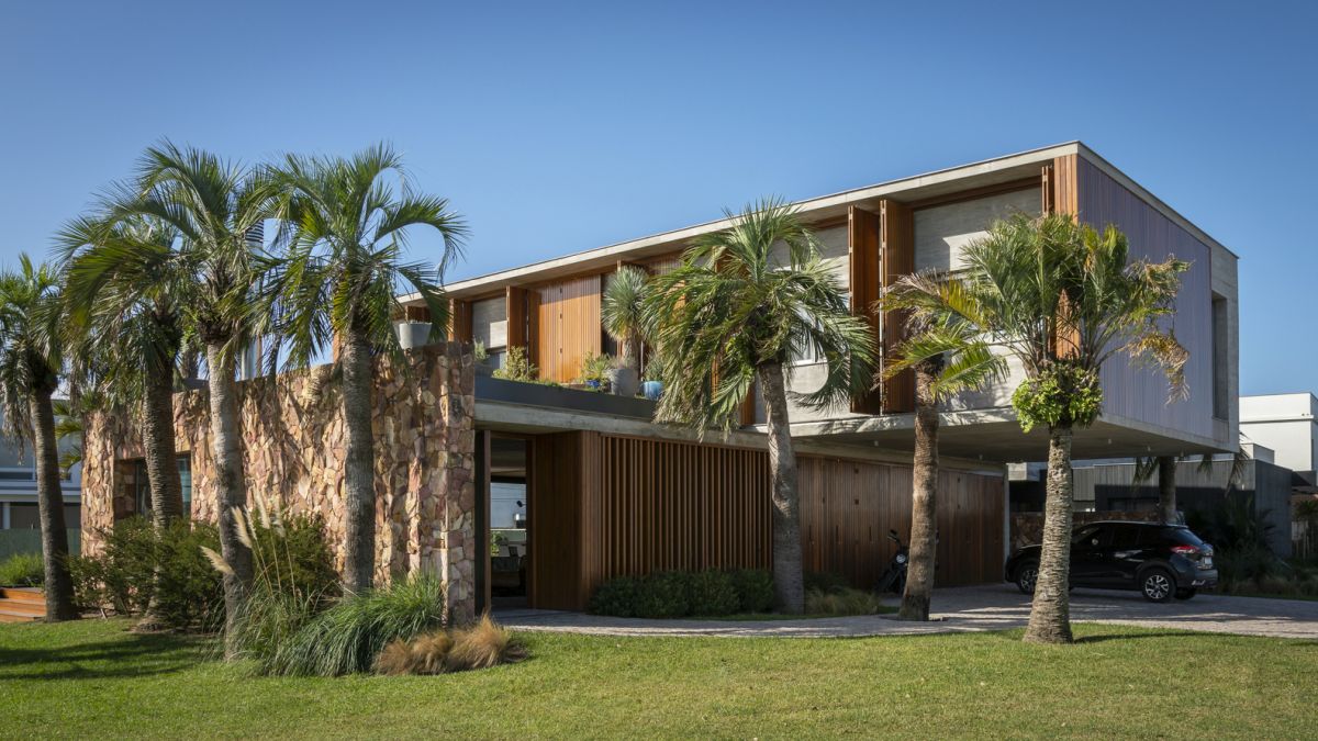 The exposed concrete structure gives the house a subtly rugged appearance