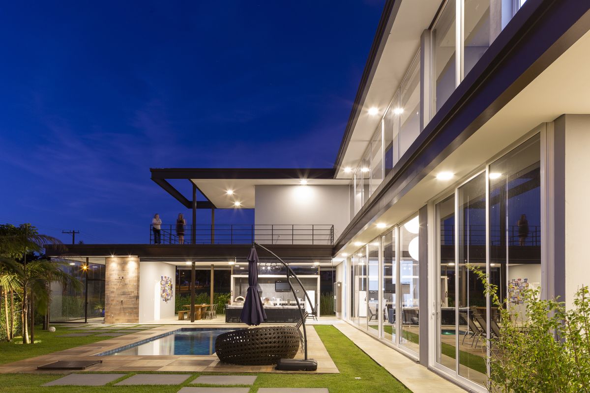 While the ground floor houses most of the common spaces, the upper floor contains the private functions