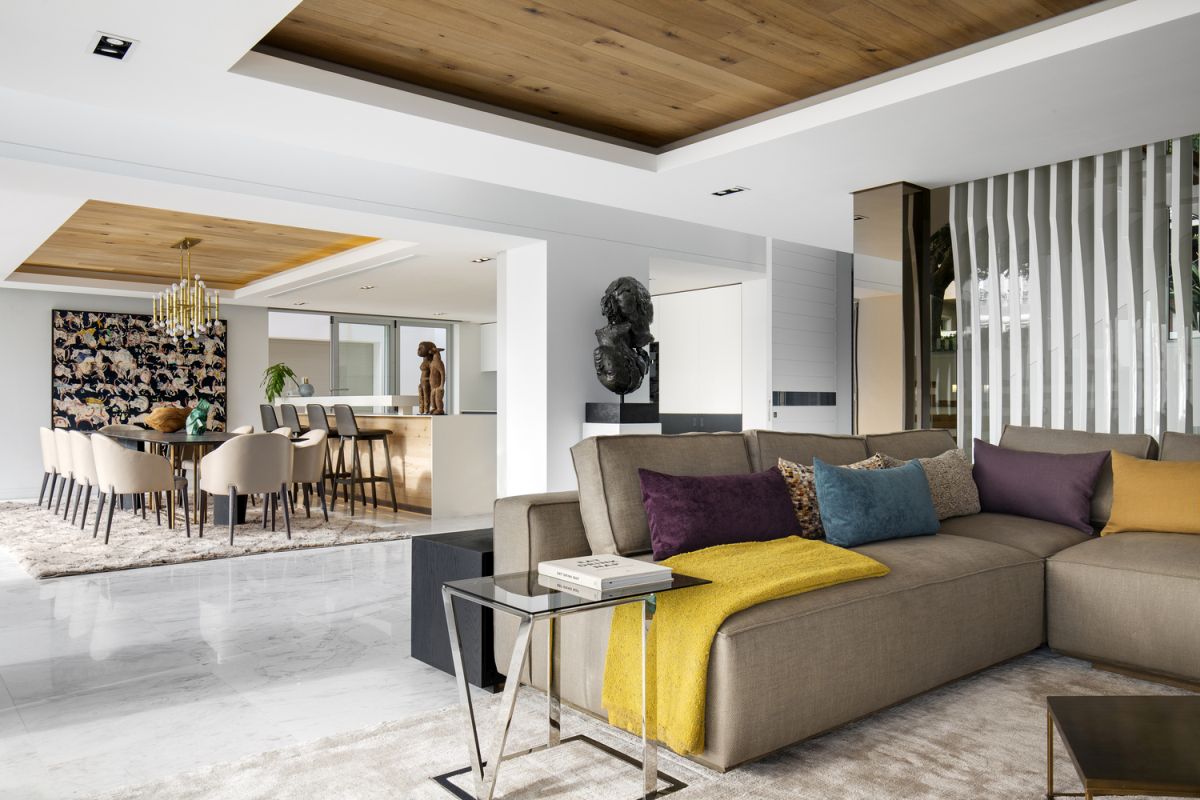 The ground floor features marble flooring and has an open floor plan organized into several zones