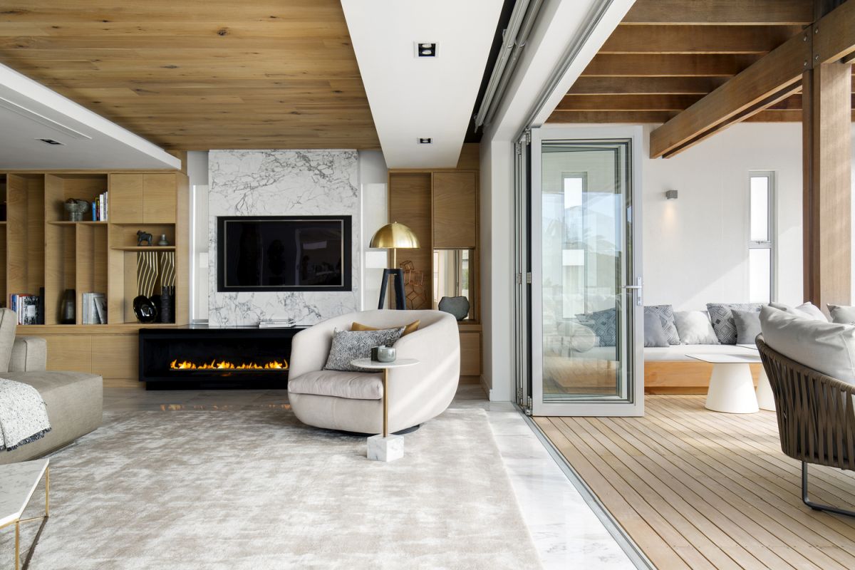 The marble floor and accent wall give the living room a refined and sophisticated look while also looking timeless