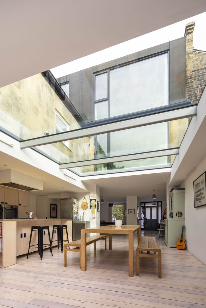 The skylights bring in lots of natural light and create a strong bond between the indoor and outdoor