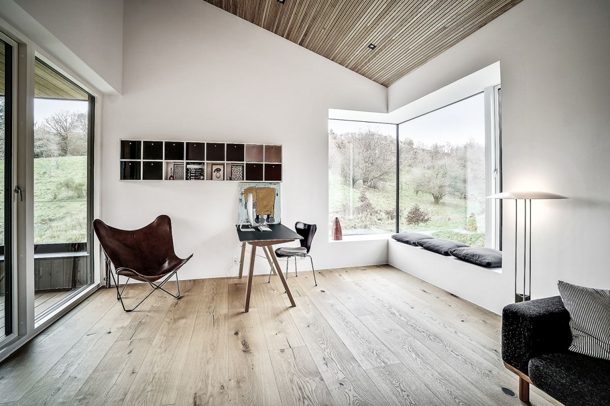 The views towards the forest and the lake are beautifully framed by large windows throughout the house