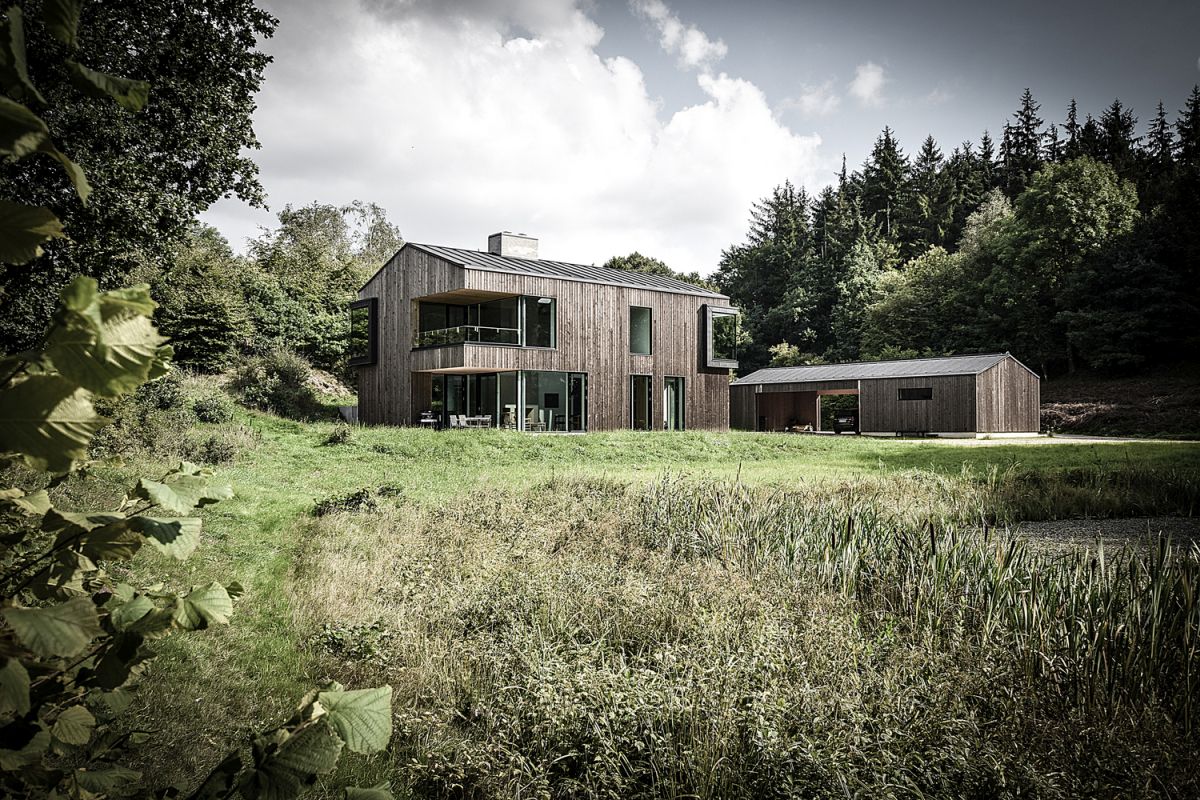 The timber-clad exterior helps the house blend into the landscape seamlessly