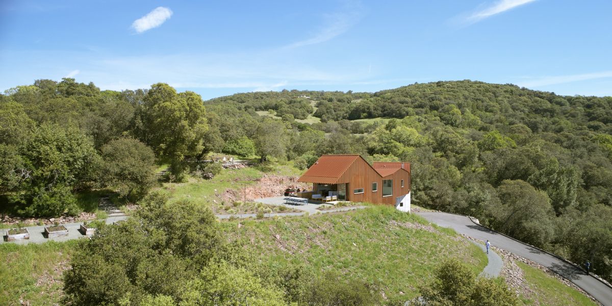 The house was built on a steep hillside on a remote site surrounded by nature from all sides