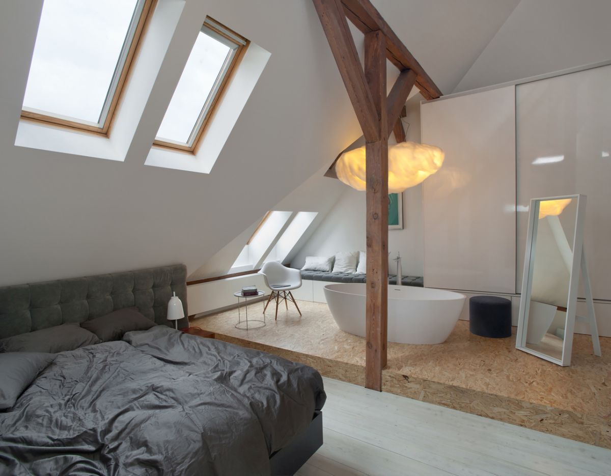 The bedroom has skylight windows and an in-room bathtub which creates a casual look