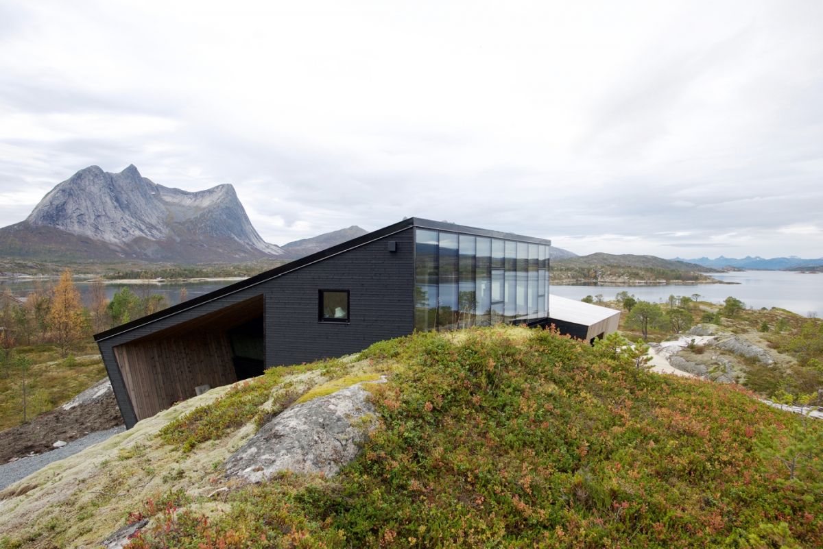 the exterior facades of both volumes feature a combination of pinewood and glass