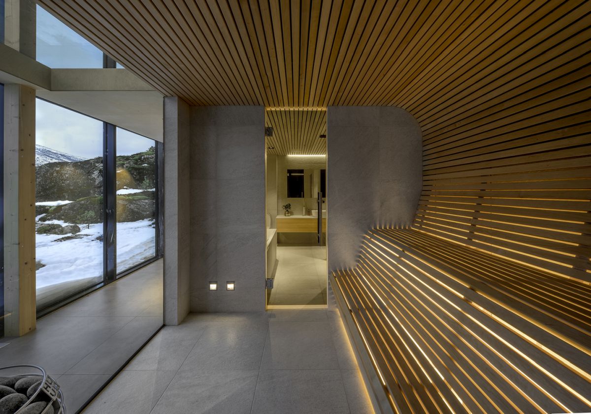 The cain has a sauna which features a combination of concrete and aspen wood, a look that extends to the bathroom