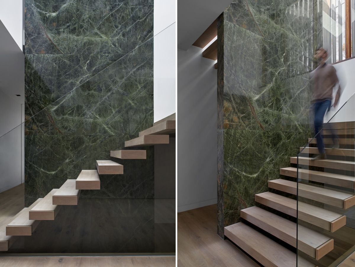 At the center of the house stands a large green stone column which a floating staircase wrapped around it