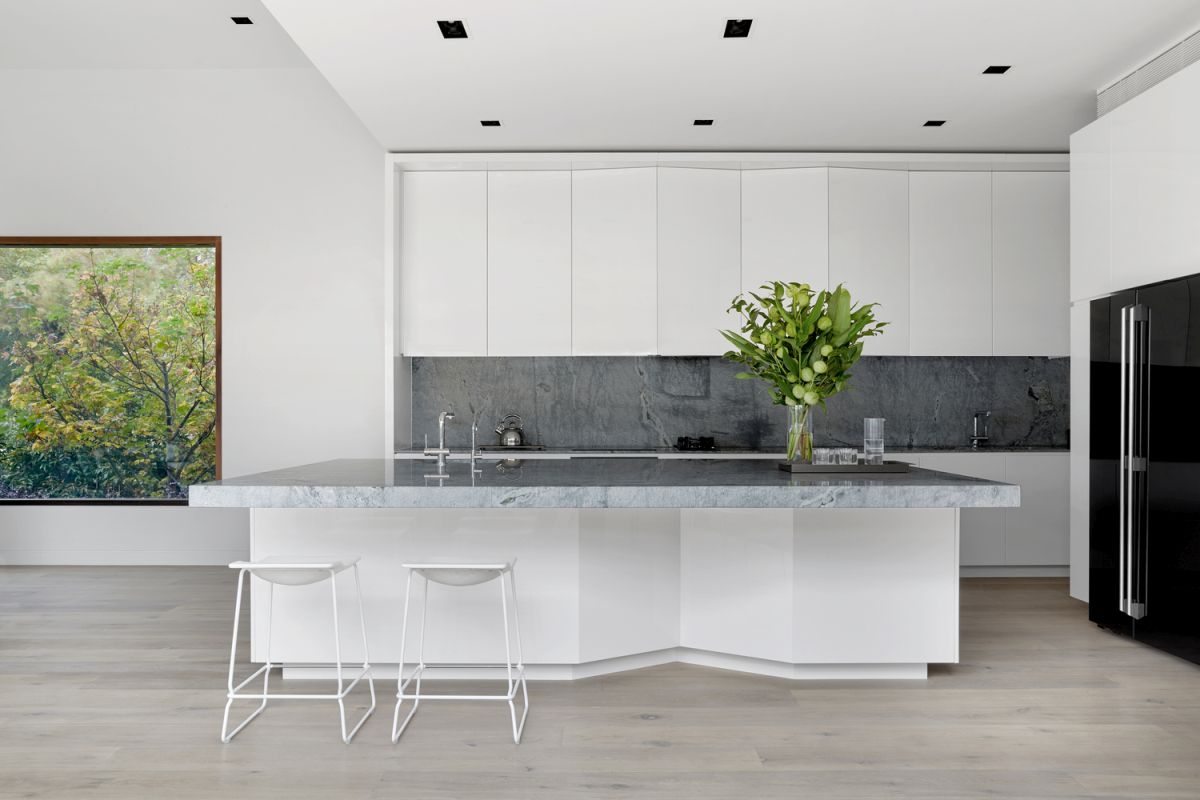 The interior design is defined by neutral colors and simple, natural materials