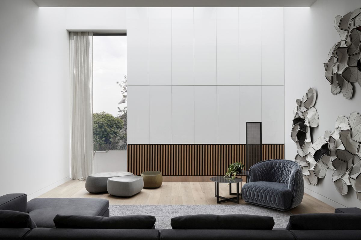 Long and narrow windows let in natural light without exposing the interior to the outside world