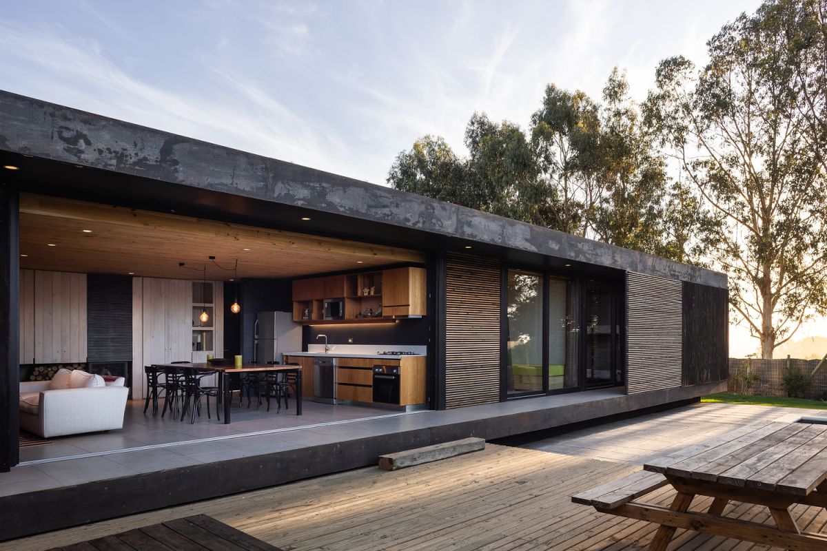 The living area opens toward the courtyard but the transition is not seamless because of the different in flooring height