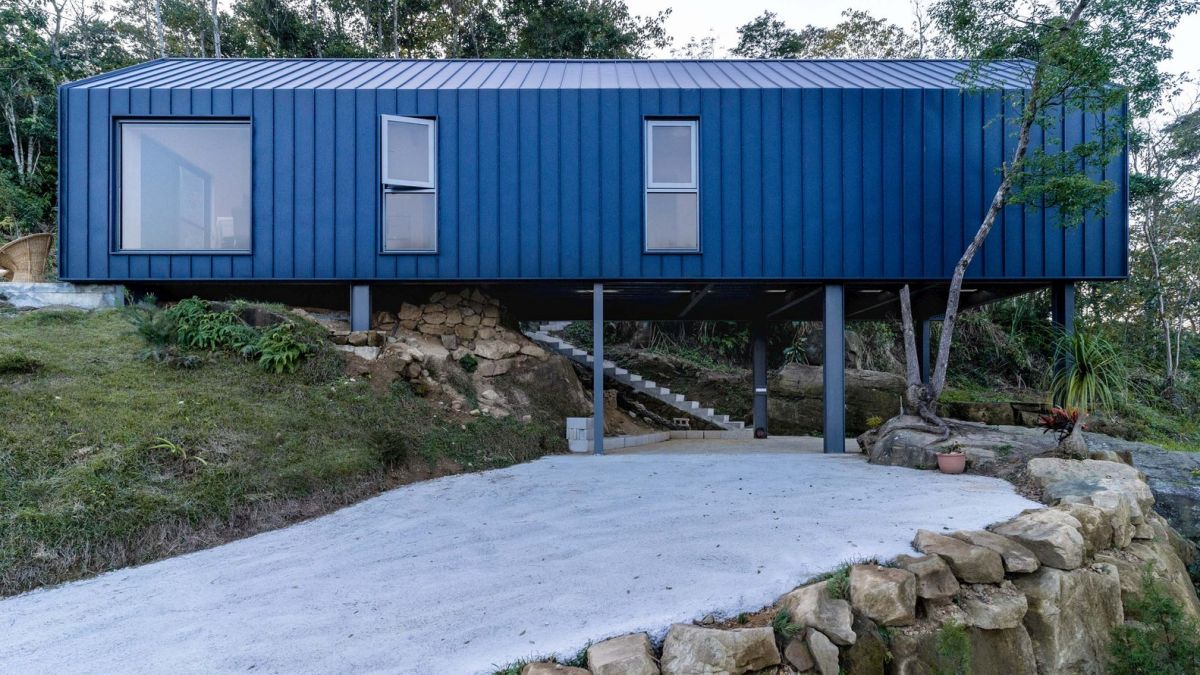 The house is almost entirely supported by columns which keeps it level without impacting the land