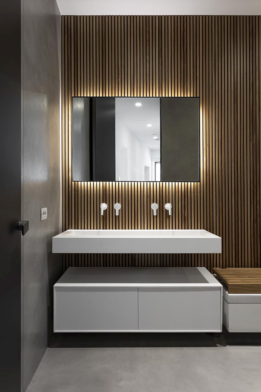 In the bathroom, the backlit mirror has a beautiful glow around it creating a pleasant mood