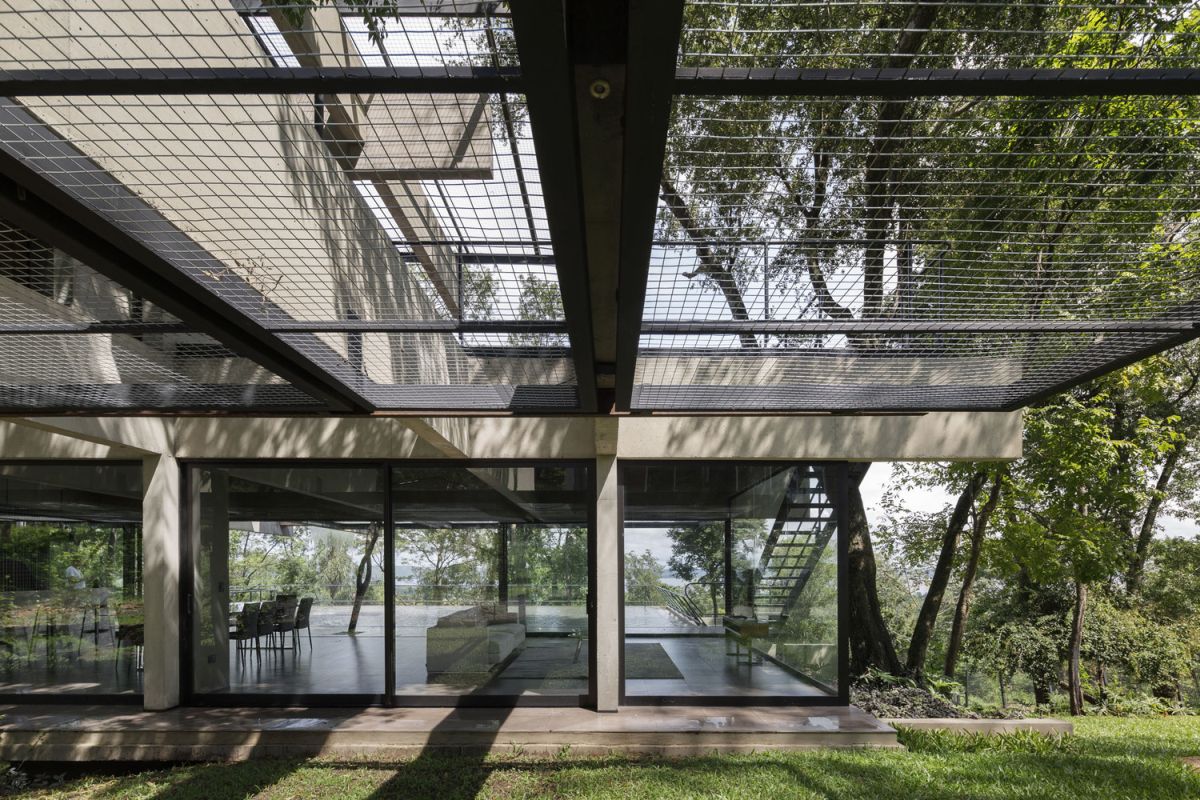 The indoor areas extend outside bringing the house closer to its surroundings