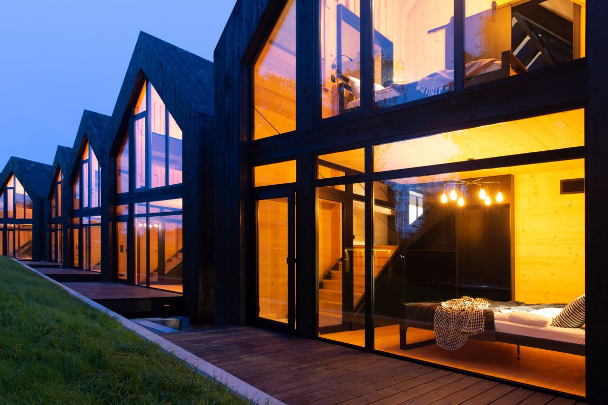 The resort houses are placed in a straight line, all facing the same views